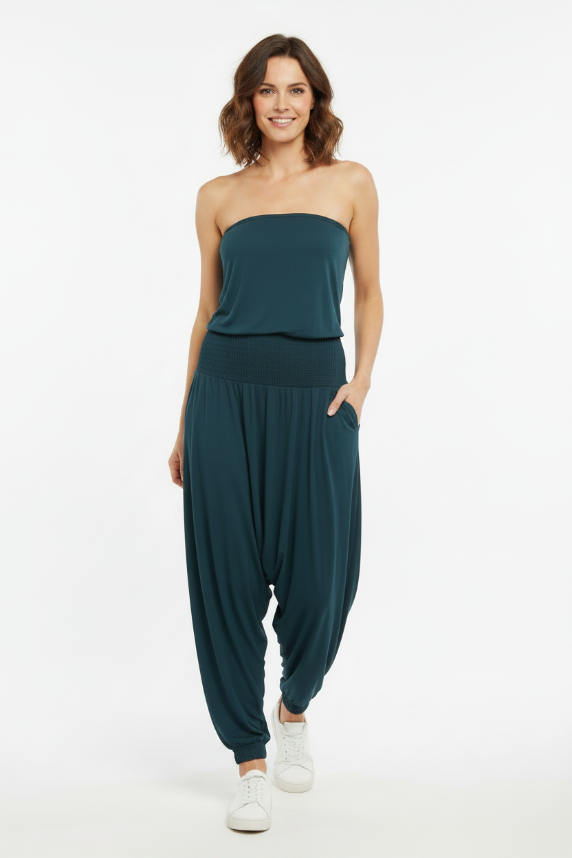 Model wearing teal strapless harem jumpsuit