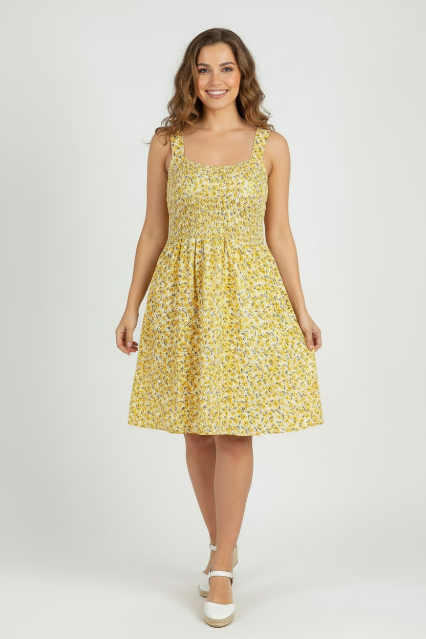 Plus size model wearing yellow floral above-knee dress