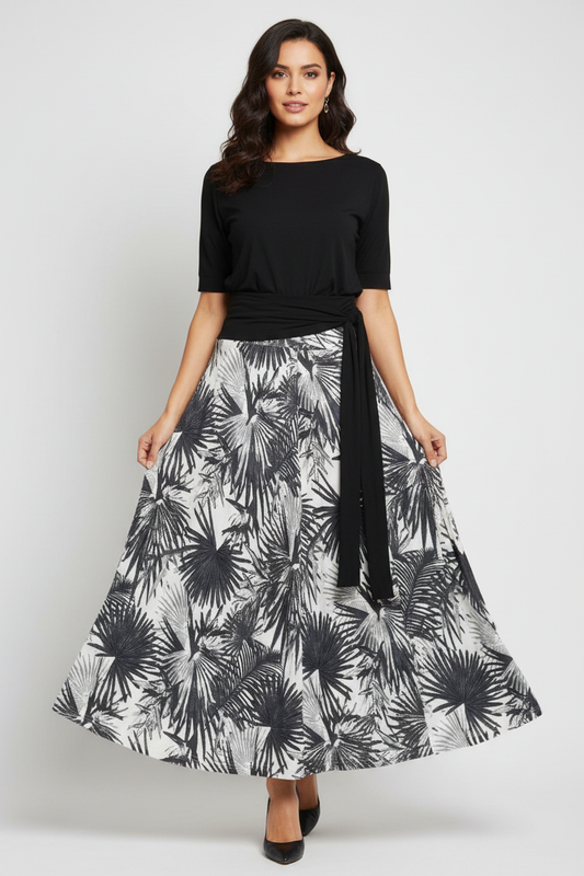 Model wearing black and white palm leaf maxi skirt