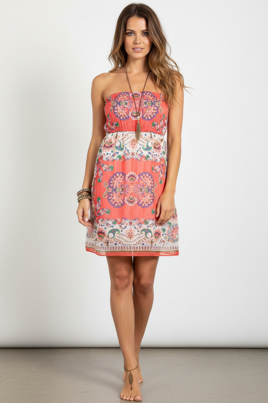 Model wearing coral paisley strapless mini dress