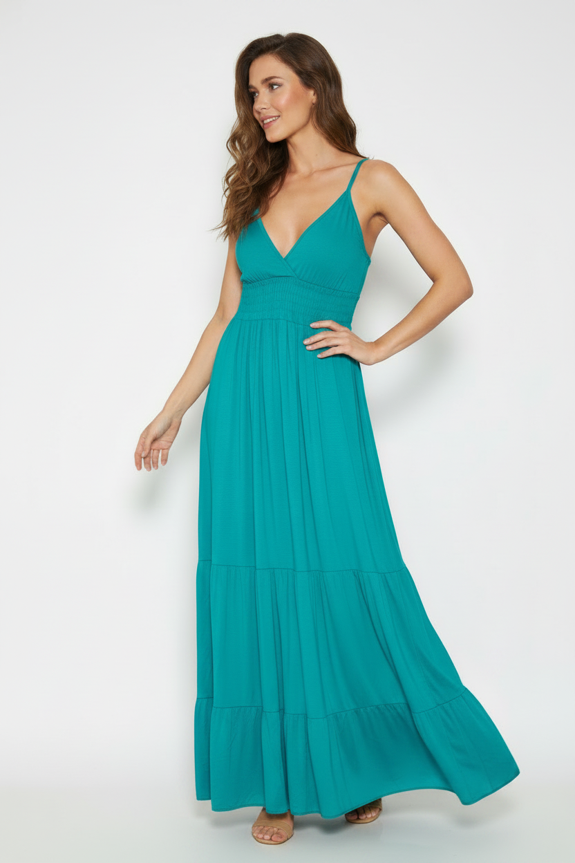 Model wearing teal maxi dress with simple bodice