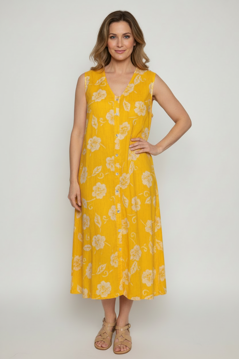 Model wearing yellow floral dress with shoes, mid-calf length